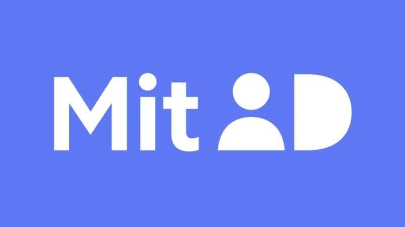 Billedet viser et logo på en blå baggrund. Teksten "MitID" vises med et stiliseret "i", der ligner et personikon.